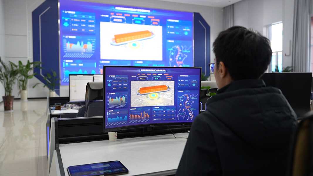 Person designing ship on screens
